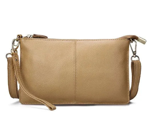 A cowhide lady slant bag in a chosen colour, showing hand and shoulder straps, with dimensions of 24 cm by 14 cm.