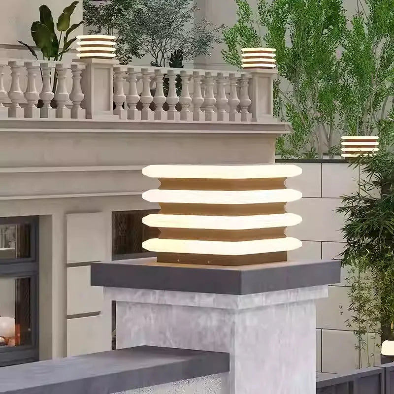 Square stainless steel solar pillar lamp on a garden wall, IP65 waterproof, available in 30cm and 40cm heights