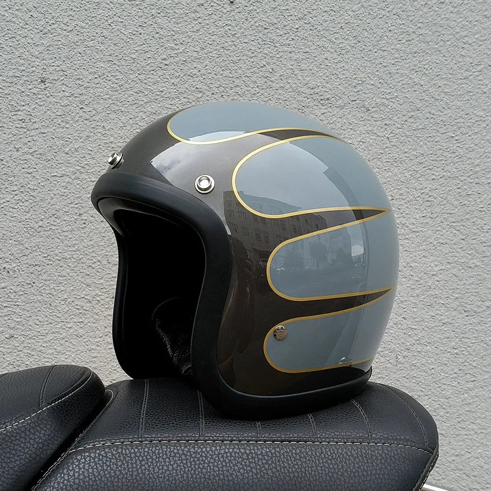 Retro-style open-face motorcycle half helmet in cement grey with a glossy FRP shell and quick-release chin strap.