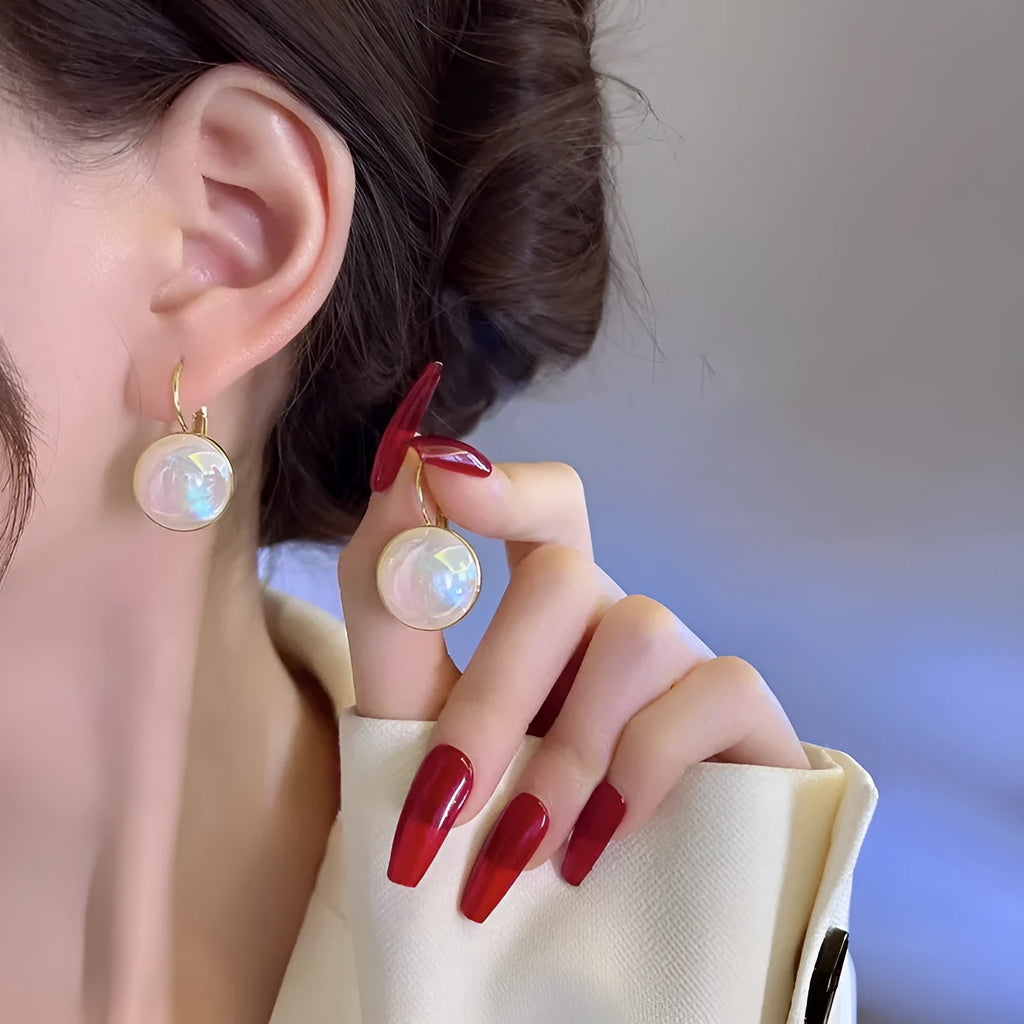 Colourful geometric Korean style metal clip-on earrings with mermaid pearl design and anti-lost clip.