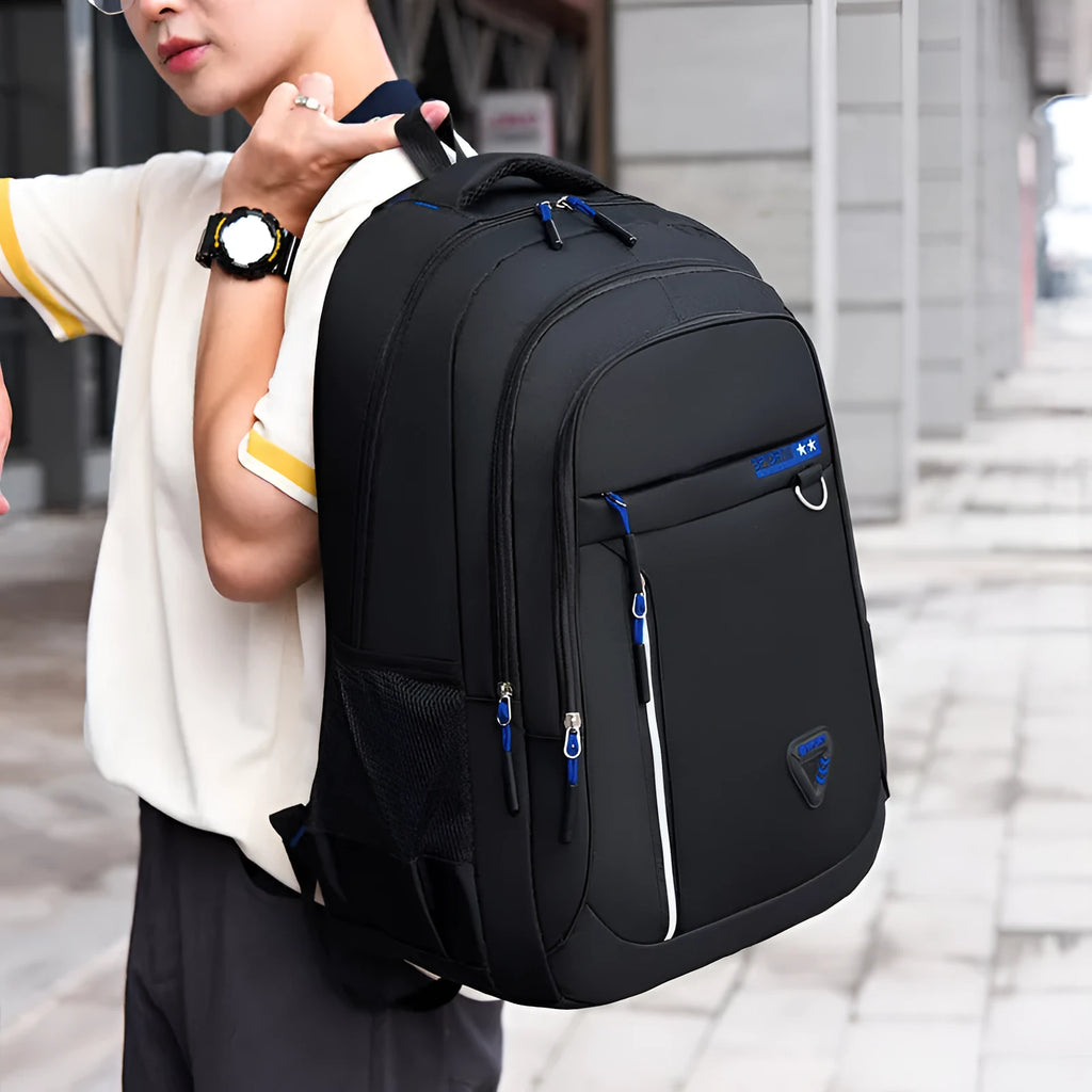 Men's Oxford cloth schoolbag in red with letter pattern design showing air pillow belt system