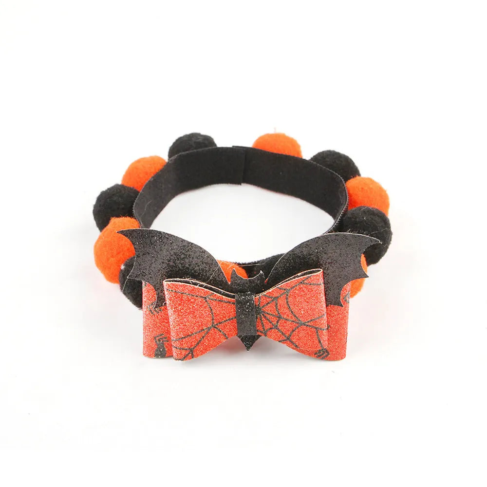 Halloween pet collar with a fur ball decoration in a pumpkin design, shown in size M.