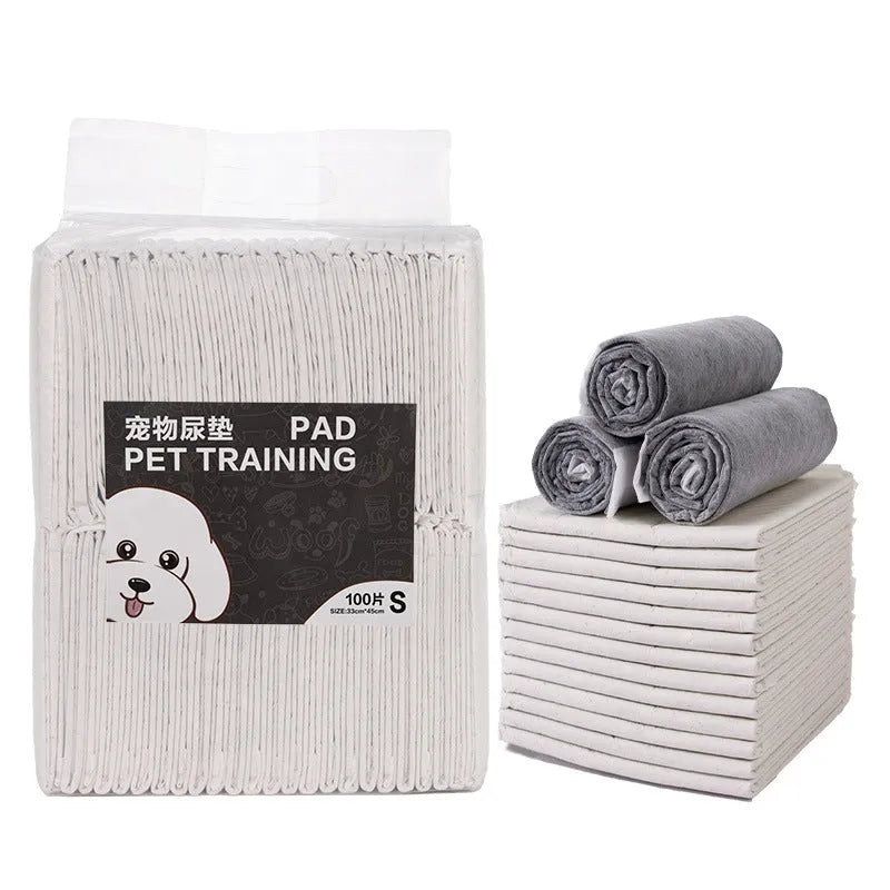 Pack of white pet urinal pads showing layered edge and bamboo charcoal variant, with size guide showing S M L XL dimensions.