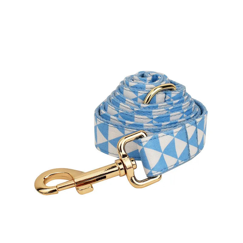 Blue cloth dog vest set with matching collar, rope leash, and bow accessory on dog mannequin