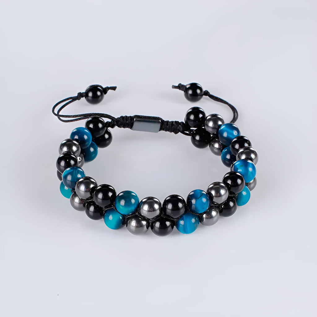 Handmade alloy bracelet with tiger's eye beads and an auspicious elephant charm in multiple colour options.