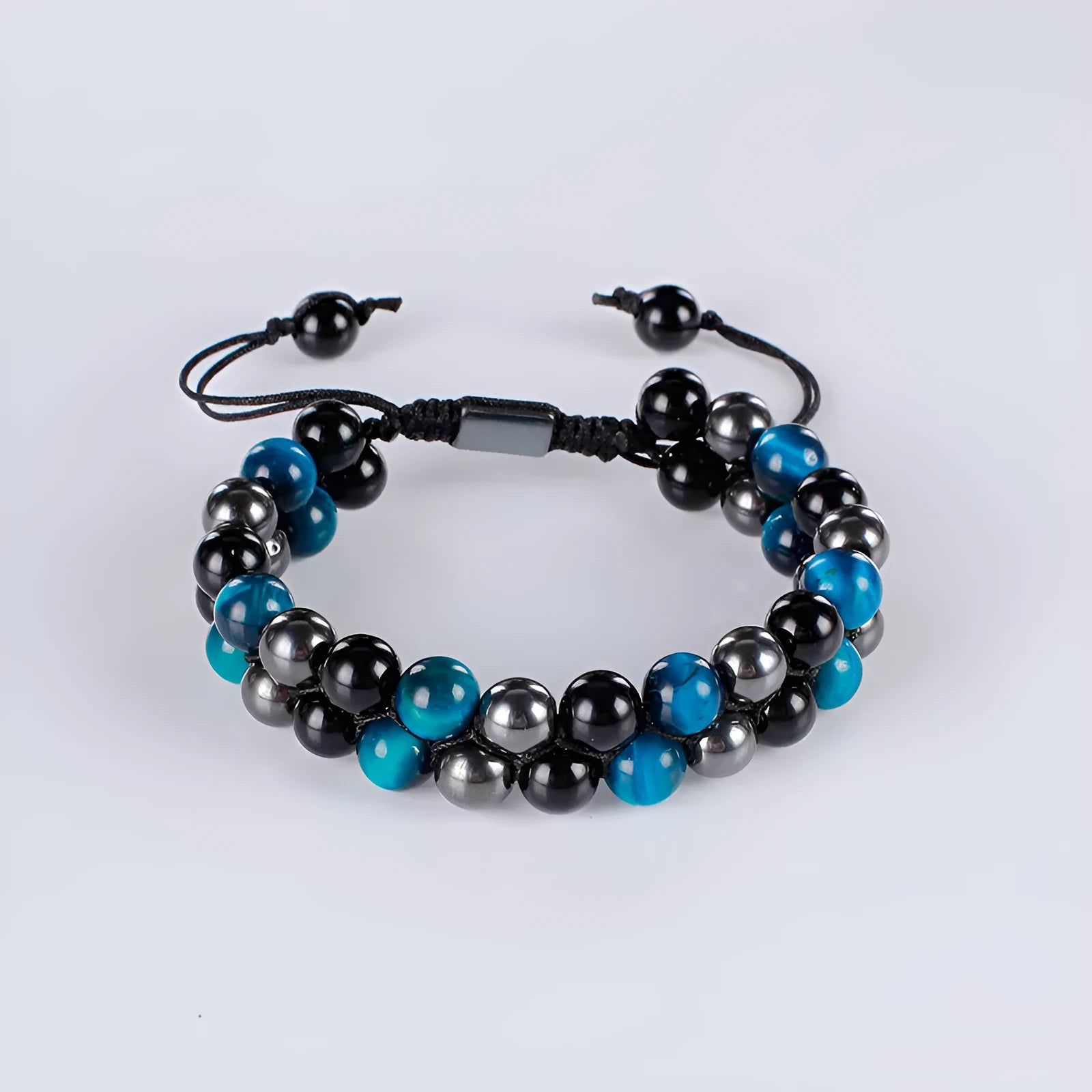 Handmade alloy bracelet with tiger's eye beads and an auspicious elephant charm in multiple colour options.