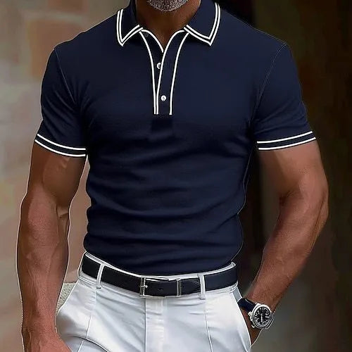 Man wearing a loose-fitting striped short-sleeved T-shirt in a casual setting.