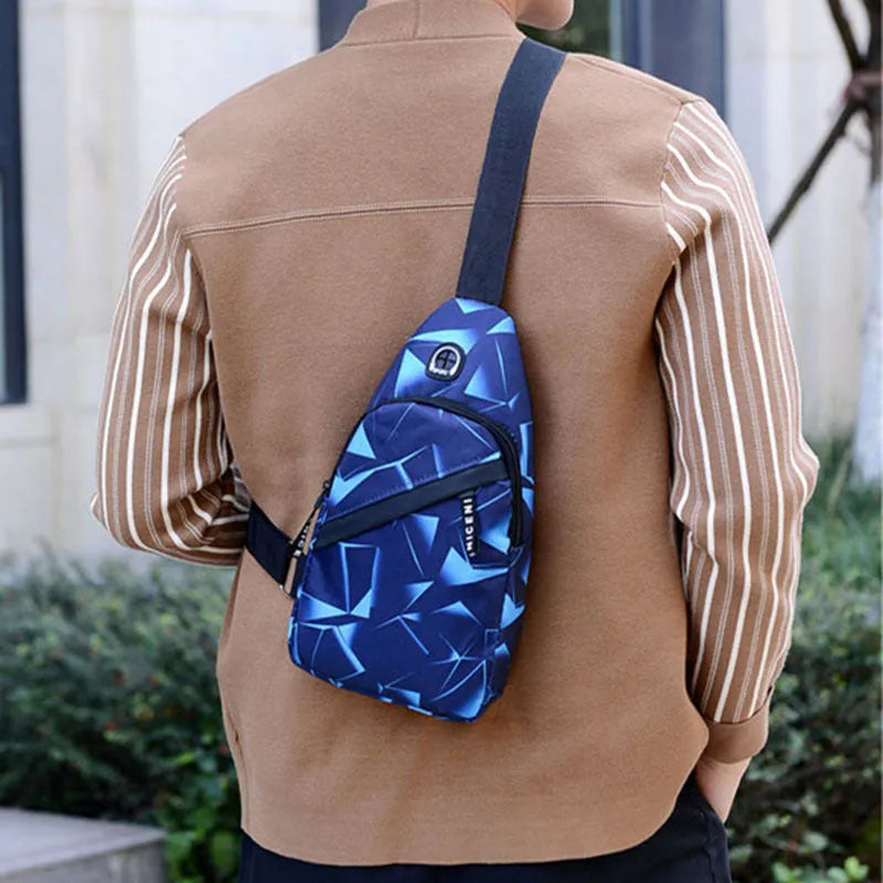 Blue Oxford cloth crossbody messenger bag with a strap, showing a front earphone hole and zipper closure.