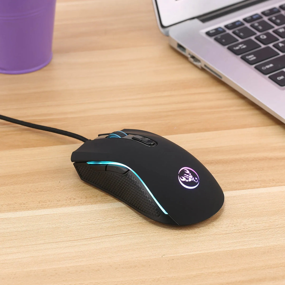 Black wired USB gaming mouse with 3200 DPI optical sensor, seven buttons, four-way scroll wheel and 1.5 metre cable for desktop computers.