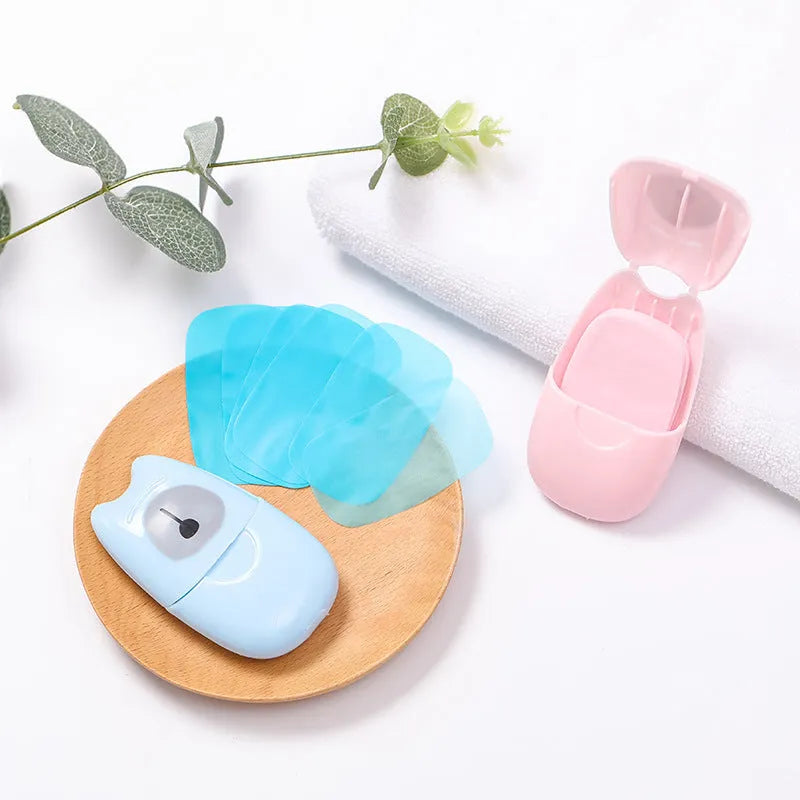 Pack of 50 disposable biodegradable soap paper sheets in pink, blue, and green colours for travel hand cleaning