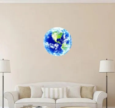 Glow in the dark 3D planet Earth wall sticker in various sizes on a blue wall