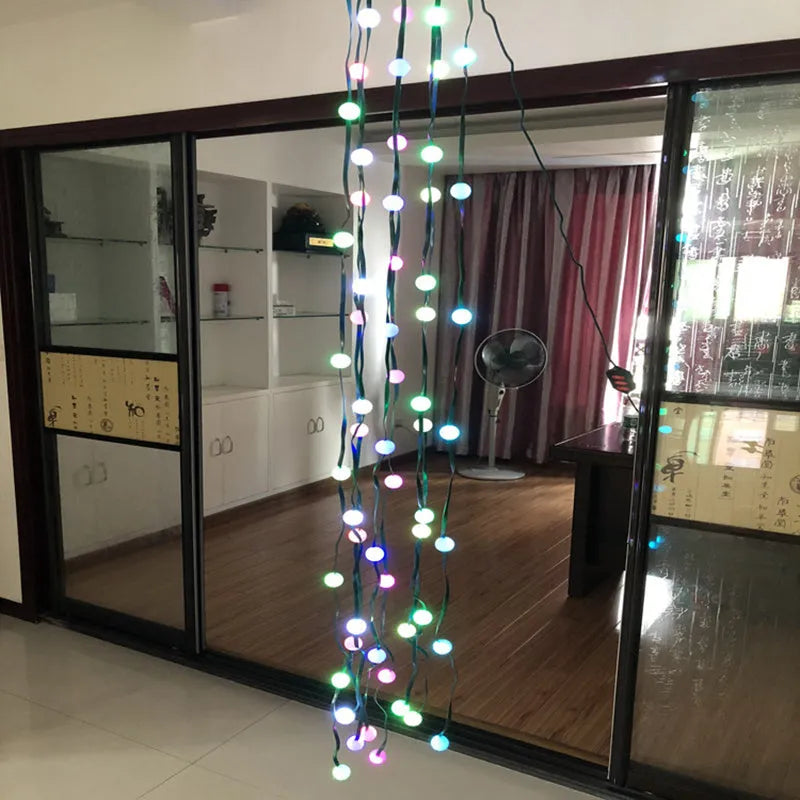 A 1.8 metre long string of 64 colourful LED Christmas lights wrapped around a green tree.