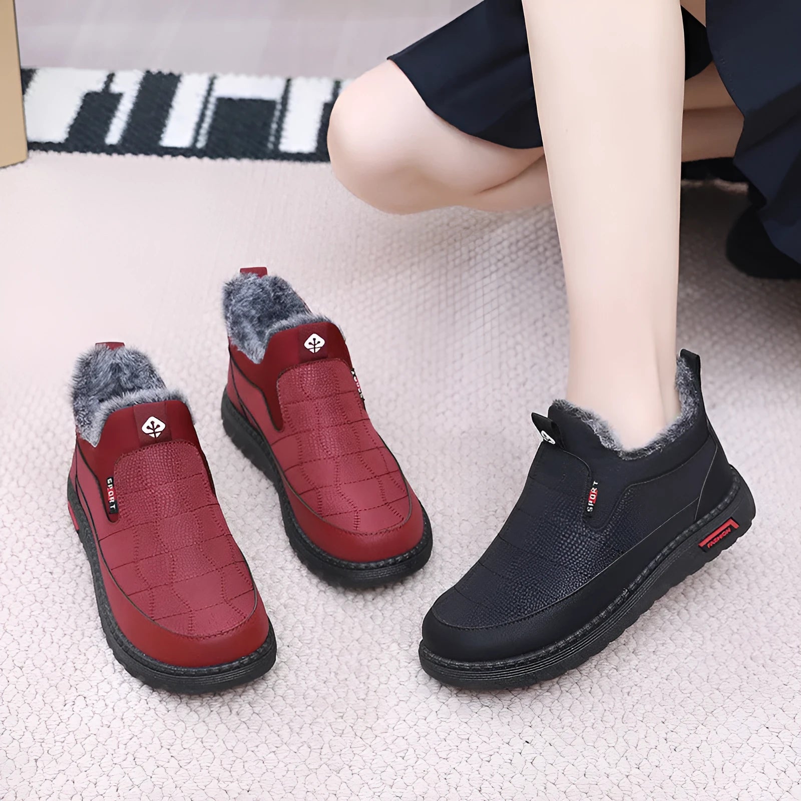 Women's black casual flat ankle boots with round toe and synthetic leather upper on a neutral background.