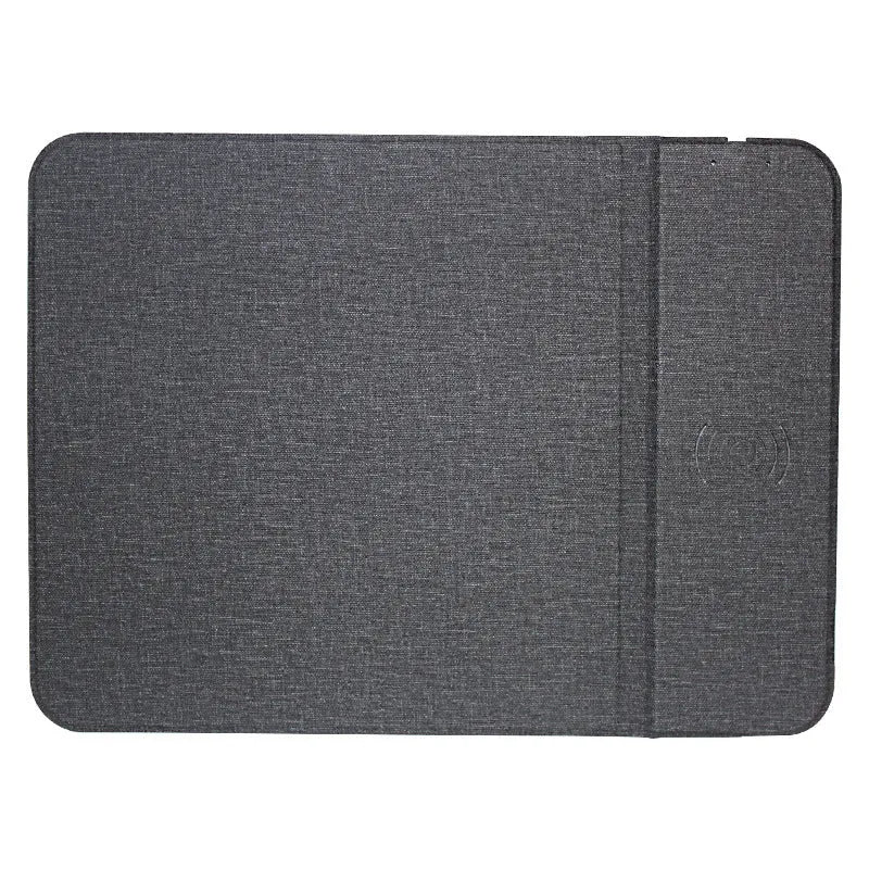 Gray foldable fabric phone holder with integrated 10W wireless charging pad on a desk.