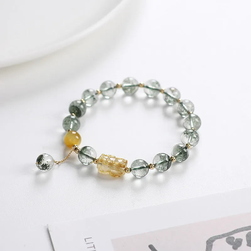 Green phantom quartz bracelet with geometric charm and gold rutilated quartz stones