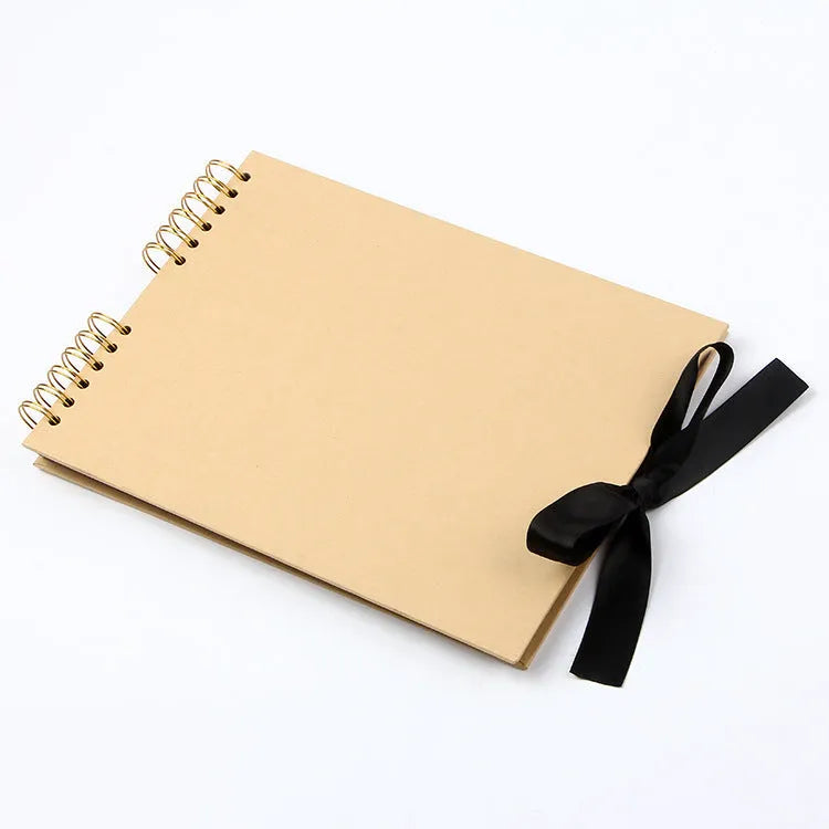 Yellow and black handmade DIY photo album with coil binding, sized 290mm by 215mm.