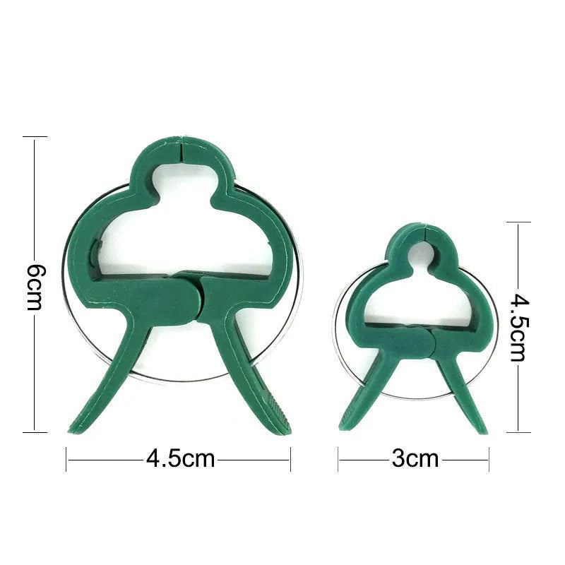 Green plastic and zinc plant fixing clips in large and small sizes for securing tomato vines and climbing plants.