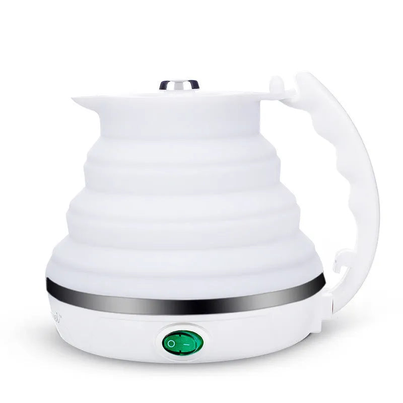 Foldable electric kettle in collapsed position showing compact 50mm height, silicone body, and power cord