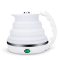 Foldable electric kettle in collapsed position showing compact 50mm height, silicone body, and power cord