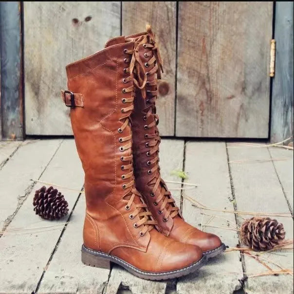 Women's black chunky heel high leg boots with a round toe and pull-on design.