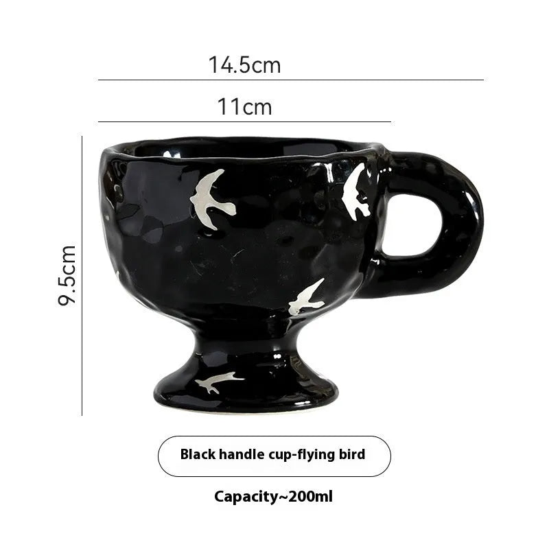 Irregularly shaped hand-pinched ceramic mug in a solid colour, shown on a plain background.