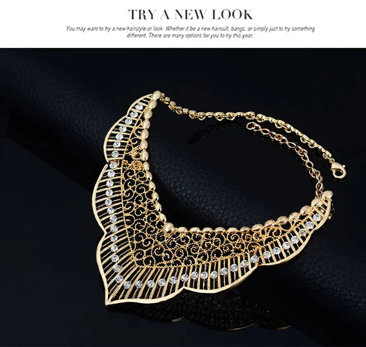 Wild style alloy necklace and earrings set in gold colour with diamond-cut finish and mixed gem inlay pendant
