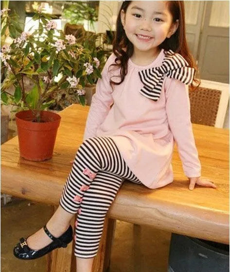 Pink cotton girls' clothing sets displayed in sizes 110cm, 120cm, 130cm and 140cm
