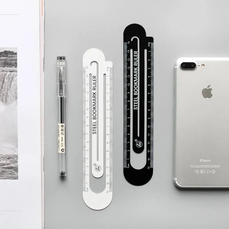 Black and white two-sided ruler showing 12cm length with manganese steel construction