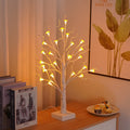 60 cm tall white birch tree LED lamp with small mushroom-shaped flowers glowing with warm light.