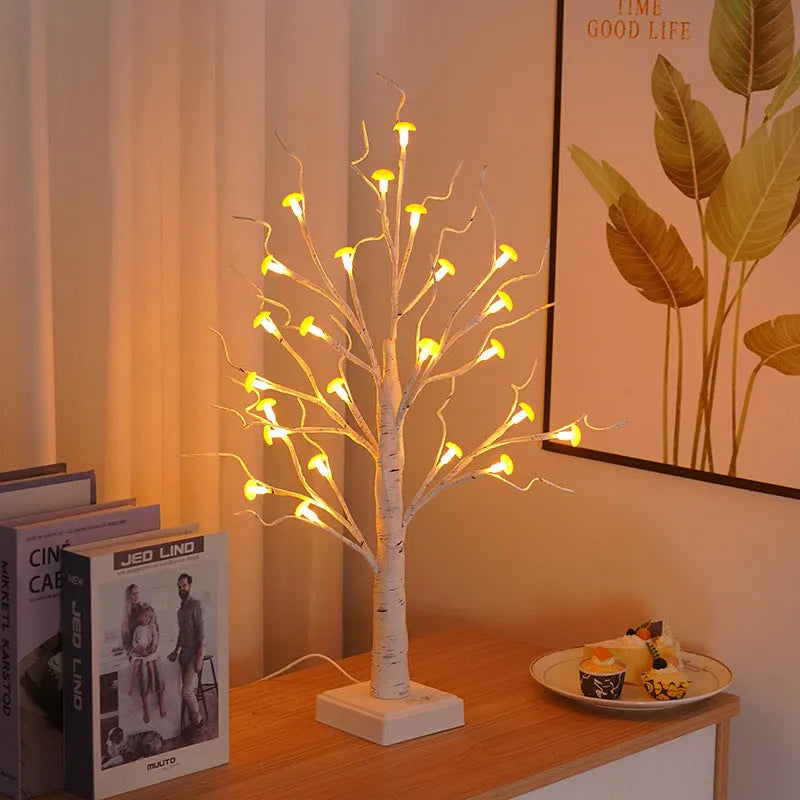 60 cm tall white birch tree LED lamp with small mushroom-shaped flowers glowing with warm light.
