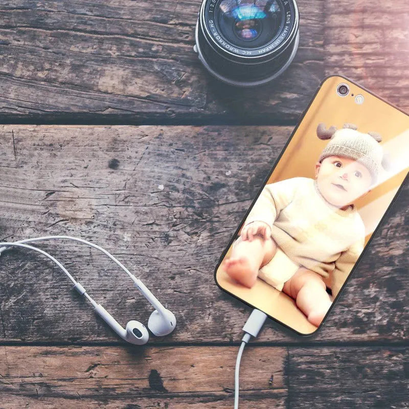 Slim patterned protective case for Apple iPhone with raised edges around screen and camera.