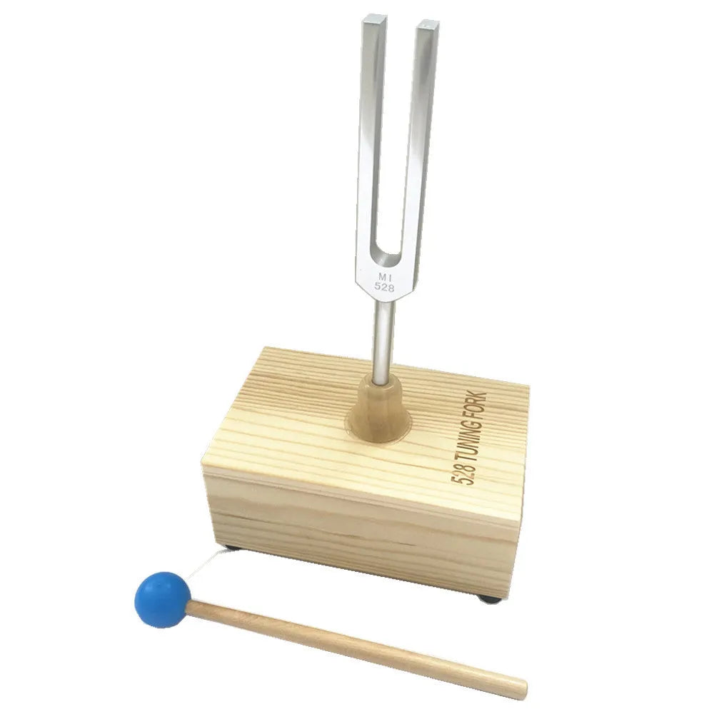 Aluminium alloy 432Hz tuning fork and speaker set on a kraft paper box.