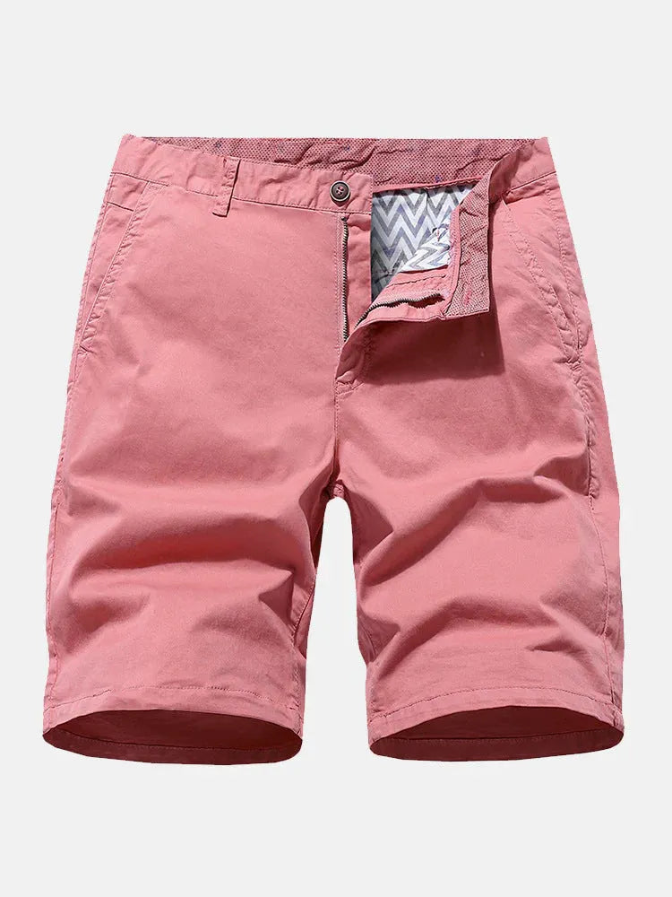 Man wearing blue printed denim casual shorts with a loose, straight leg fit and no belt.