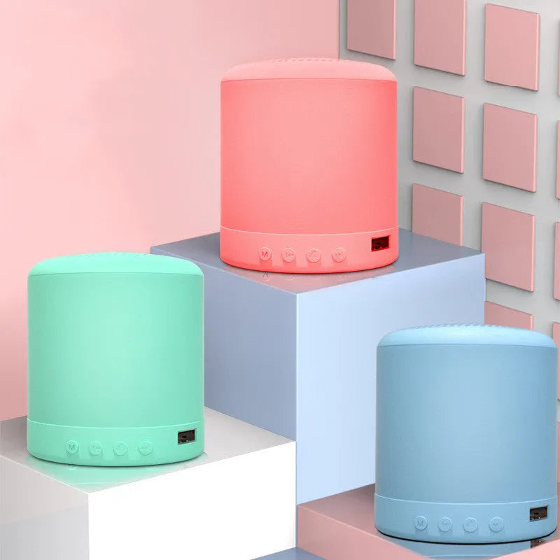 A11 compact wireless stereo speaker in black, pink, blue, or green colours measuring 62x62x73.7mm