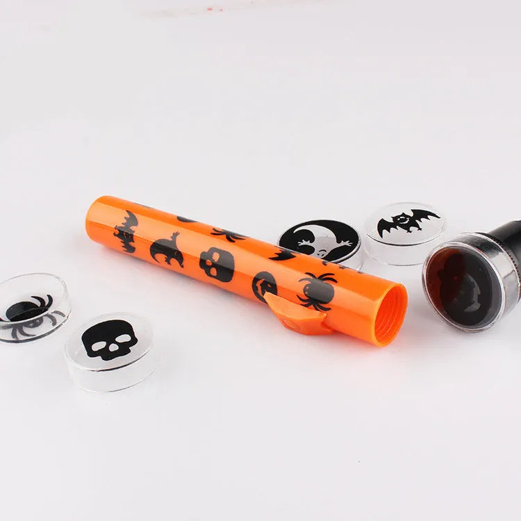 Orange metal pumpkin skull flashlight projection lamp with textured metal finish