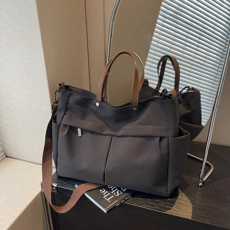 Nylon crossbody tote bag in black grey white green colours showing dimensions 39x28cm
