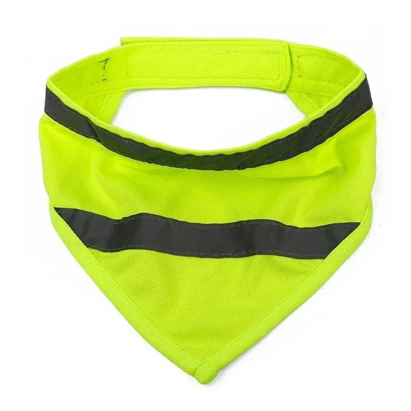 Yellow and orange reflective dog bandana with striped design and adhesive strap, shown on a dog's neck.