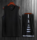 Student basketball training vest and pants set in white or black, made from polyester fibre blend.