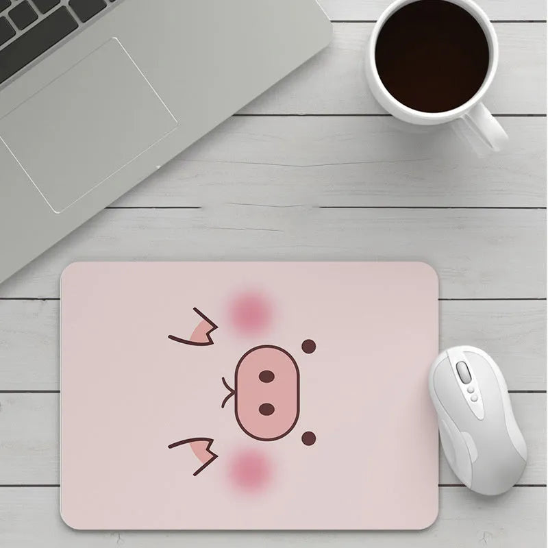 Thick custom cartoon mouse pad with colourful design on a desk, showing black seam edge