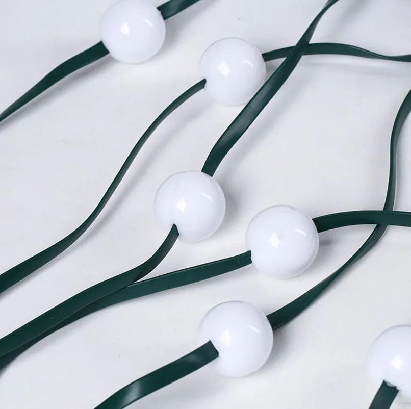 A 1.8 metre long string of 64 colourful LED Christmas lights wrapped around a green tree.