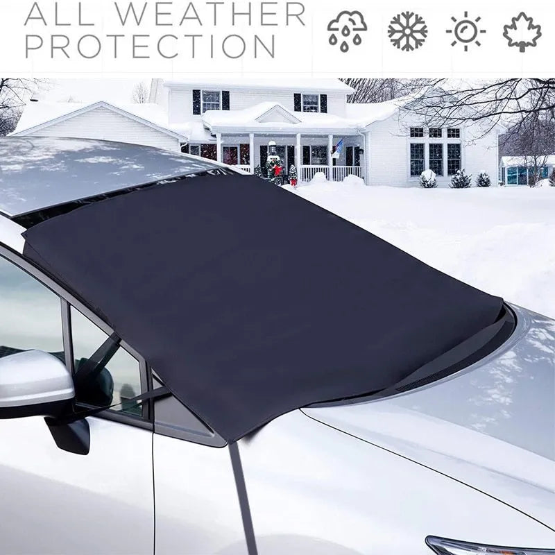 Black rubber Oxford cloth windshield ice and snow gown draped over car windscreen in winter