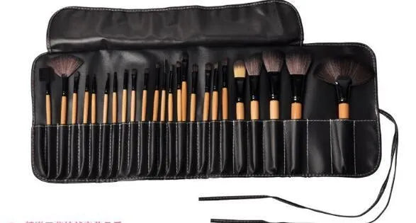 24 professional makeup brushes with wooden handles stored in a black PU gift bag.