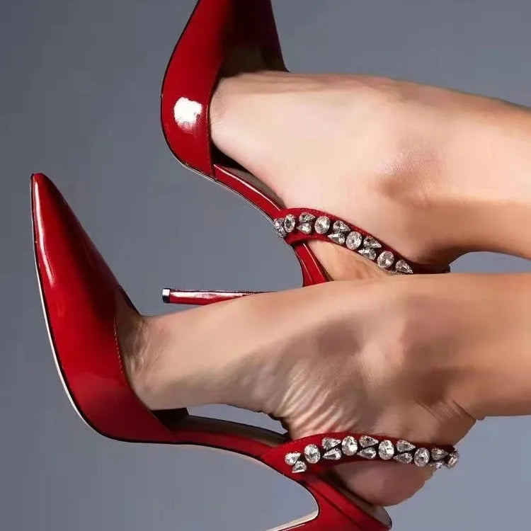 Women's black patent leather pointed toe high heel sandals with side rhinestone decoration.
