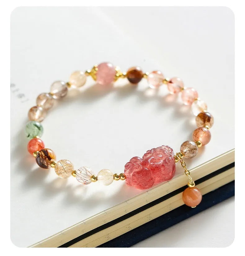 Chinese-style strawberry quartz crystal bracelet with copper construction, Pixiu charm, and pearl accents in dopamine crystal colour