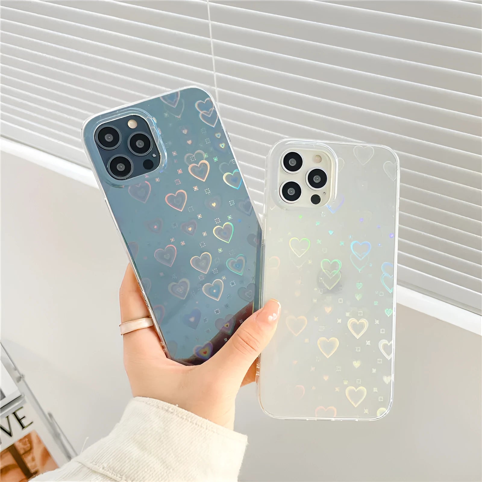 Transparent silicone iPhone case with a laser-etched colourful love pattern.