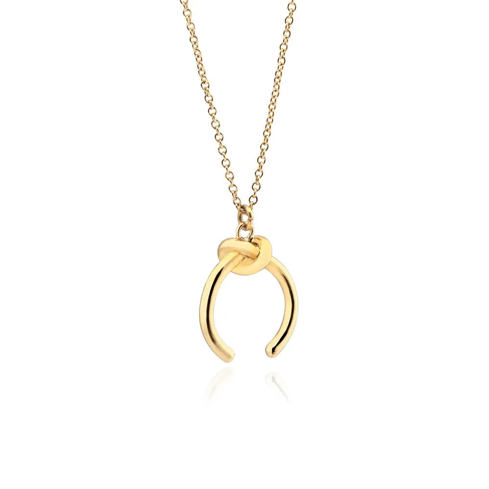 Vintage geometric copper pendant necklace with an adjustable cross chain in a gold finish.