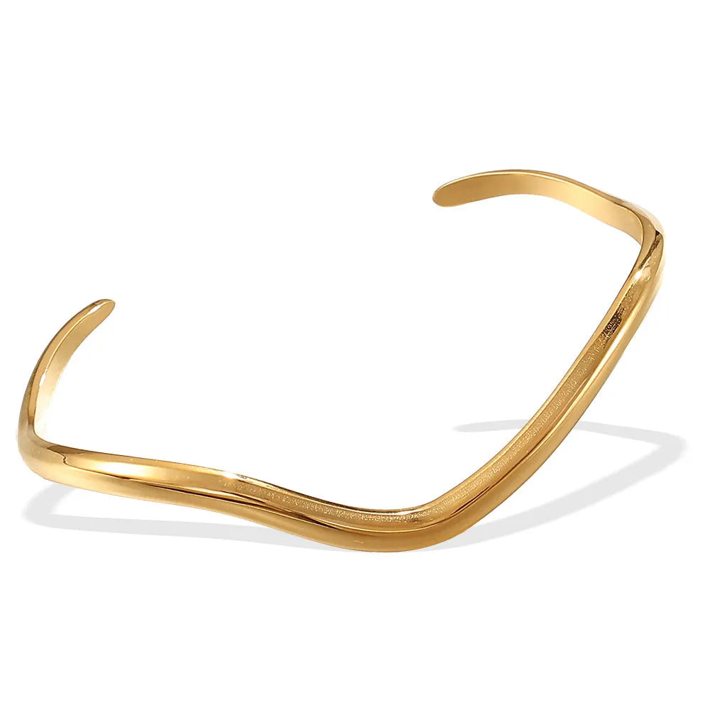 Niche Minimalist Open-end Gold Ripple Line Bracelet on wrist showing ripple texture and electroplated finish.