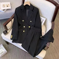 Women's loose-fit long sleeve polyester blouse in black, shown in a professional setting.
