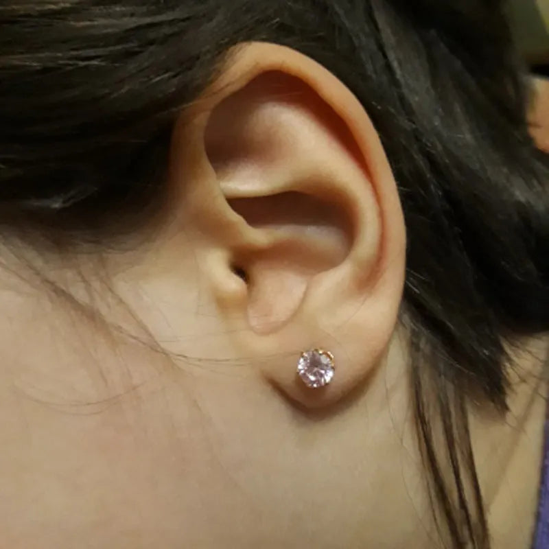 Disposable ear piercing gun with gold lavender zircon crown stud earring made from 316L stainless steel