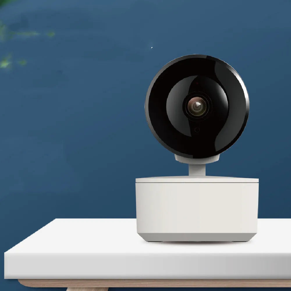 White indoor WiFi security camera with 1080P resolution and automatic motion tracking on a desktop stand